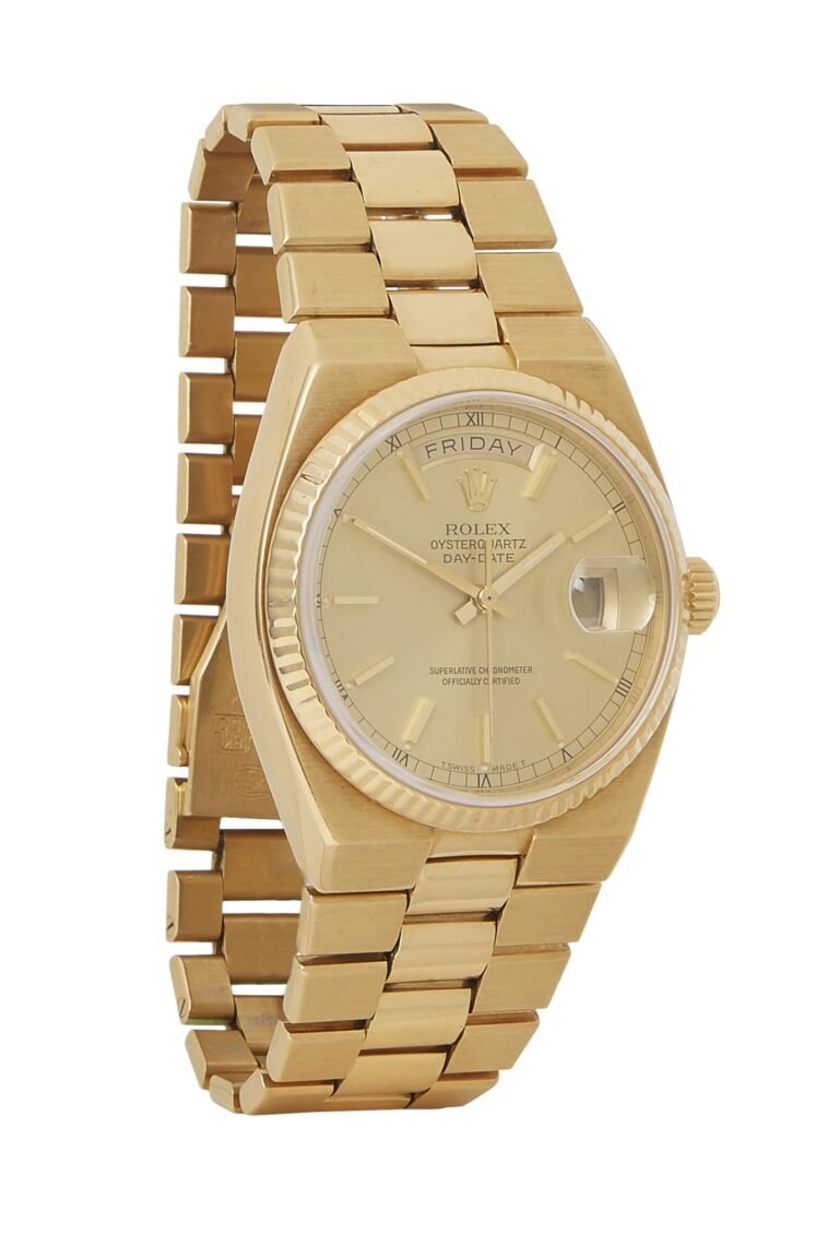 Gold Rolex Oysterquartz Day-Date watch with Friday display and gold band